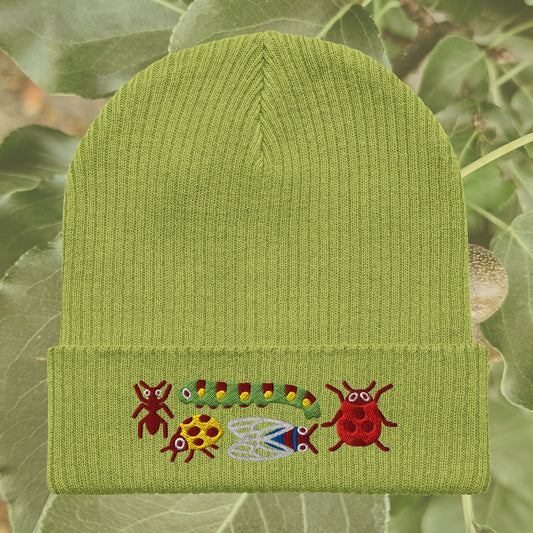 Leaf green ribbed knit beanie embroidered with whimsical woodland critters including bugs and caterpillar. Cozy organic cotton hat for cottagecore and nature lovers.