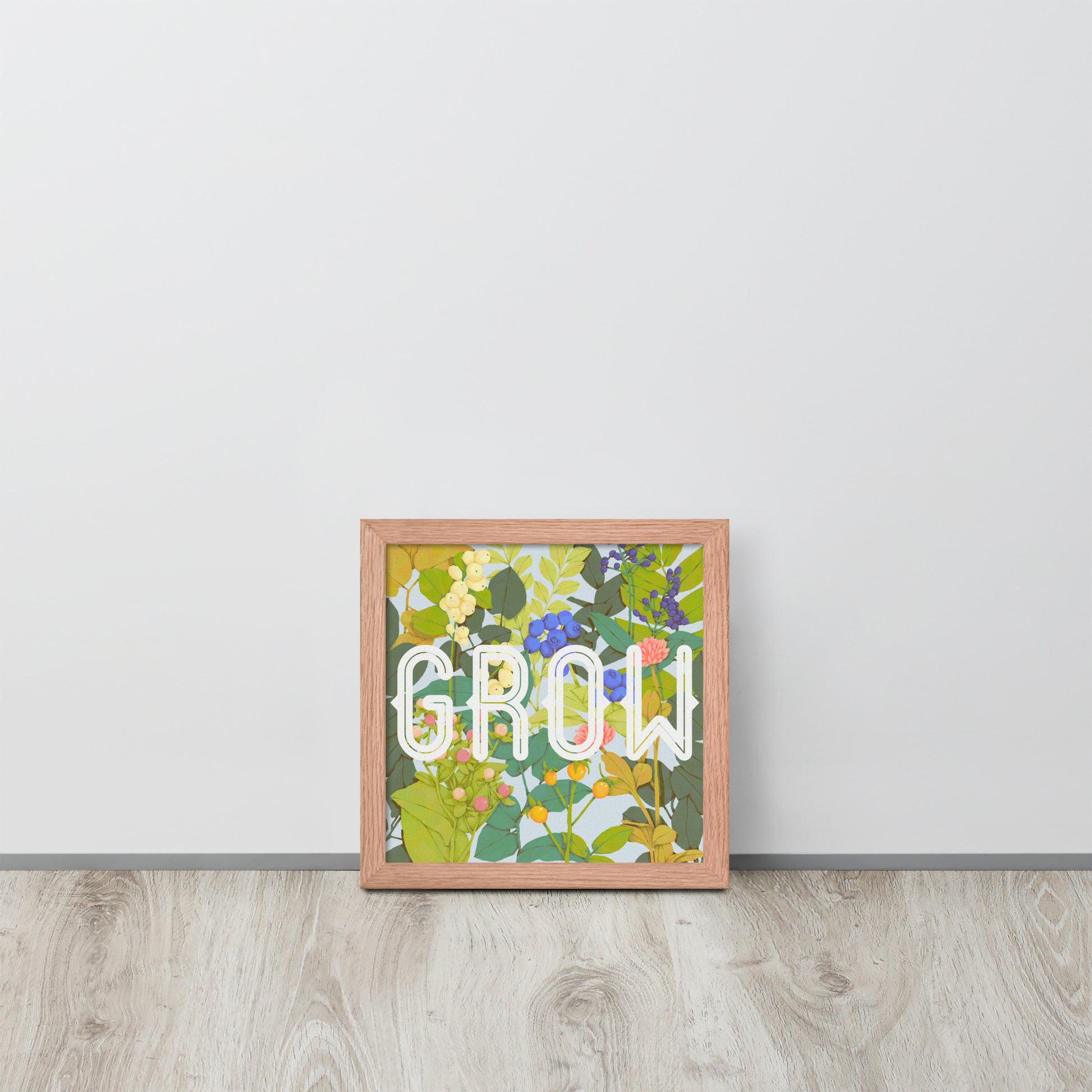 Decorative wall art with floral design and 'GROW' text on a white wall.