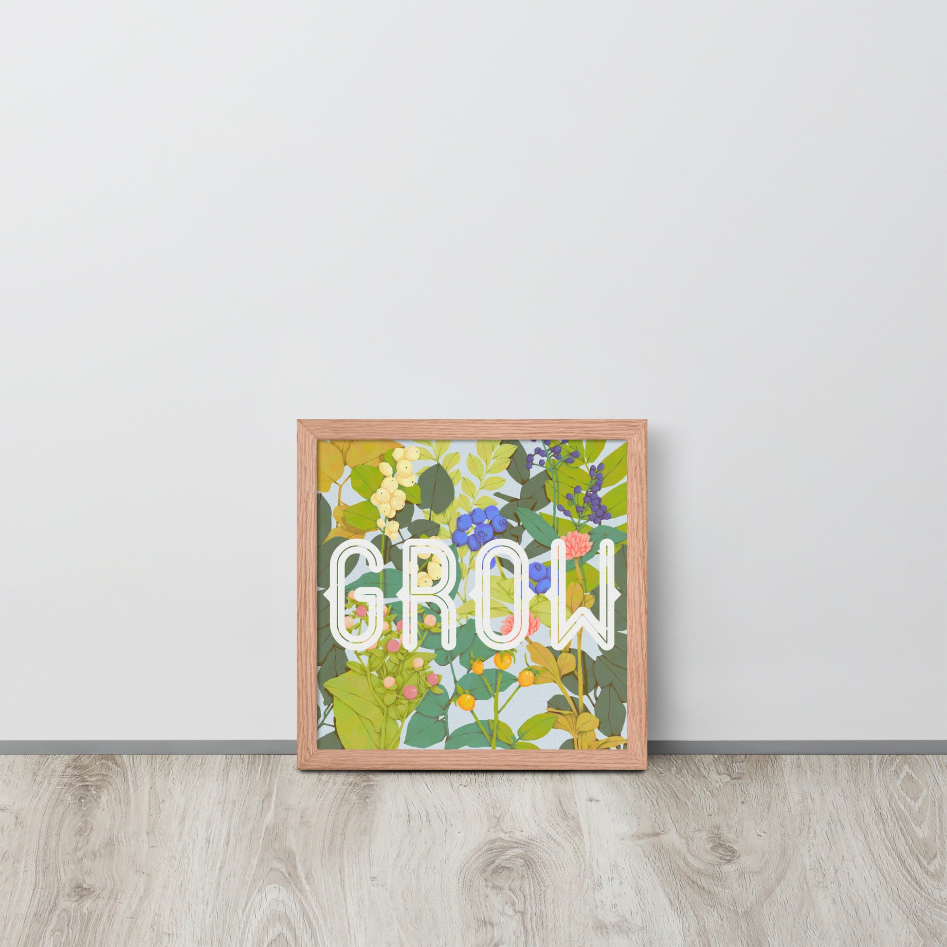 Framed artwork with floral design and 'GROW' text on a white wall.