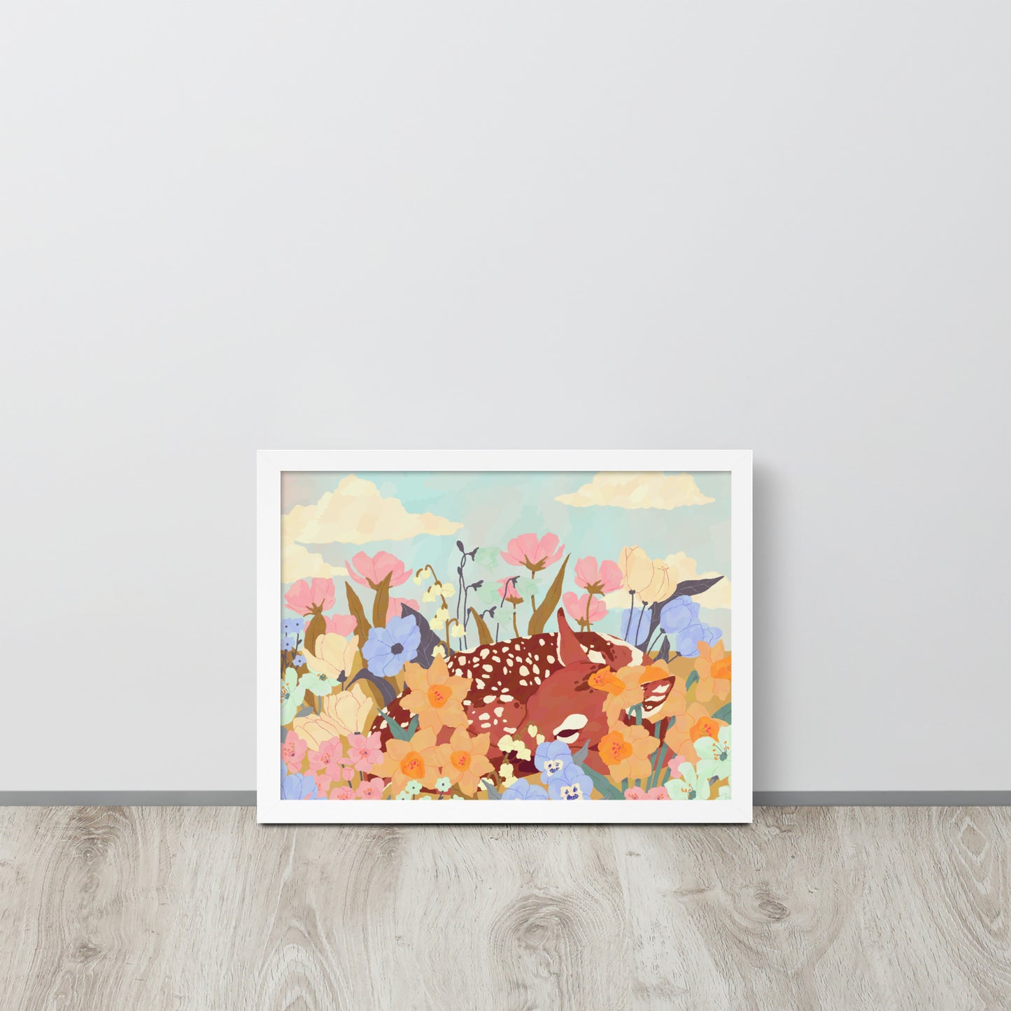 Framed illustration of animals and flowers on a light gray wall.