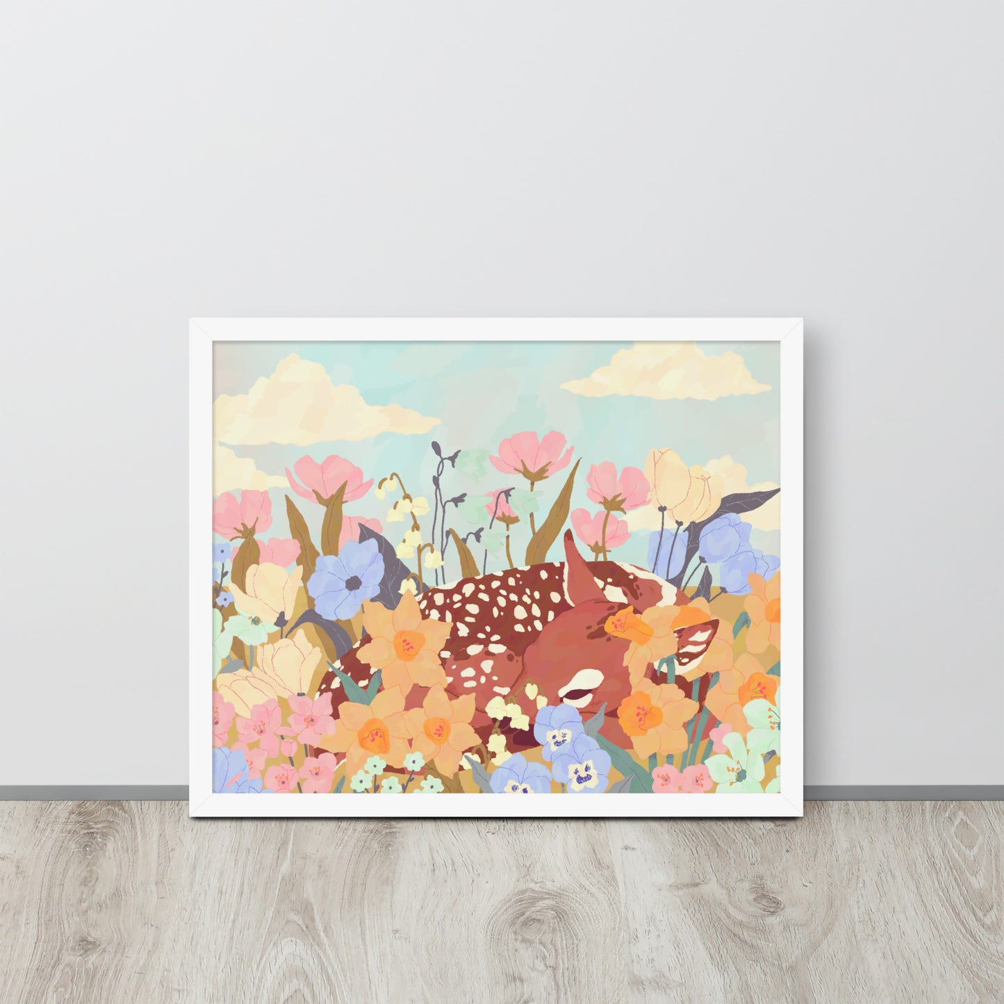 Framed artwork of deer and flowers on a light gray wall.