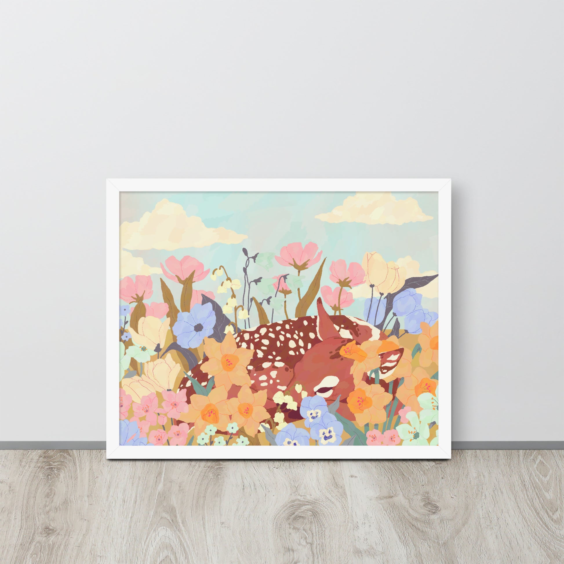 Framed artwork of deer and flowers on a light gray wall.