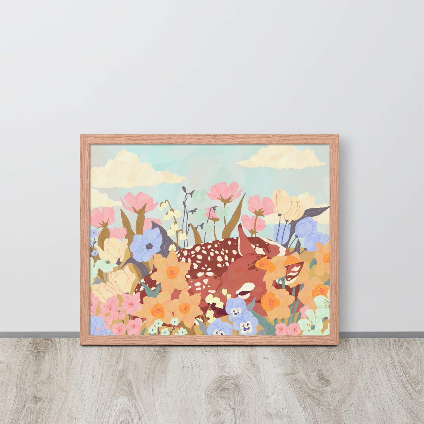 Framed artwork of deer and flowers on a light gray wall.
