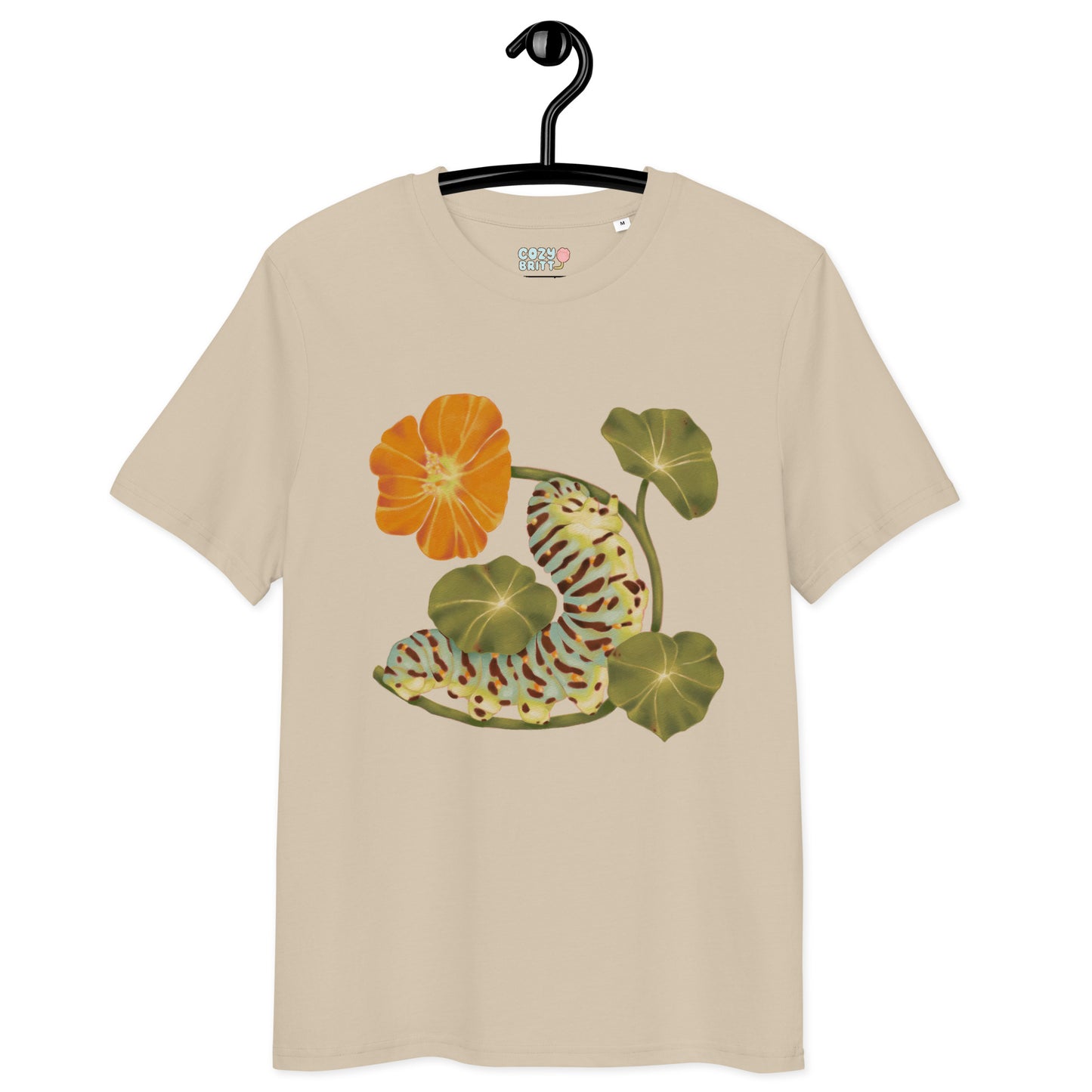 Beige t-shirt with floral design on a hanger against a white background