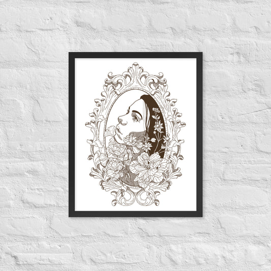Framed artwork of a woman's face with floral elements on a textured white wall.