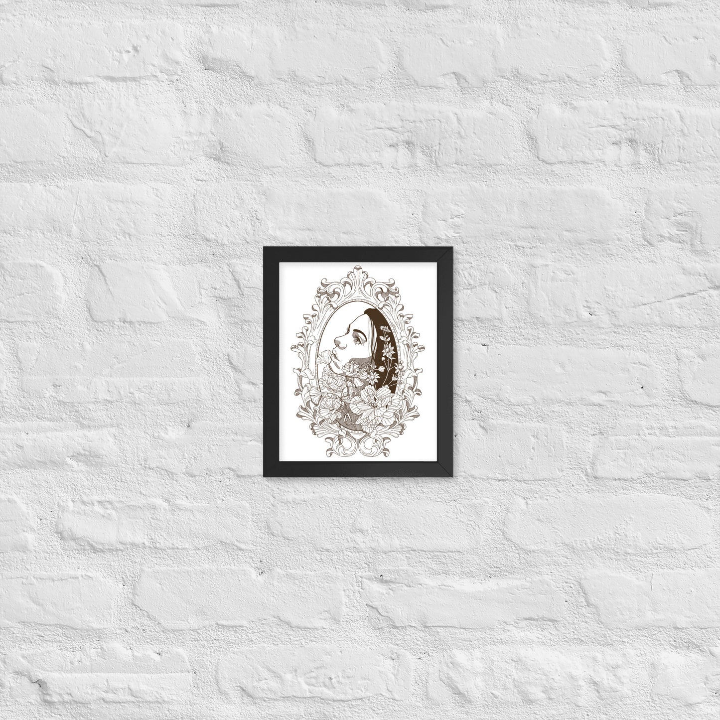Framed artwork of a stylized face with floral elements on a textured white wall.